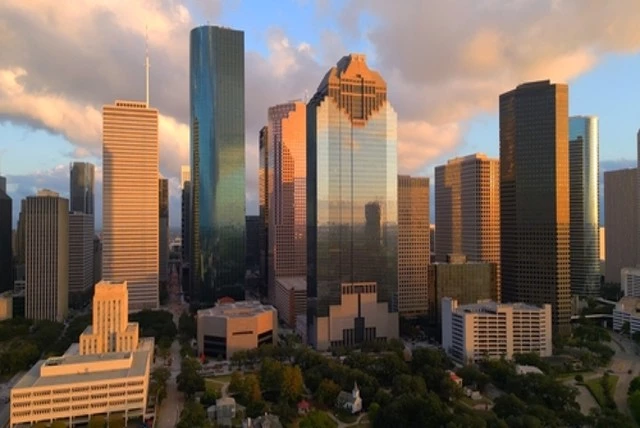 Houston Texas skyline at sunset, take a tour with Private Chauffeur Service in Houston