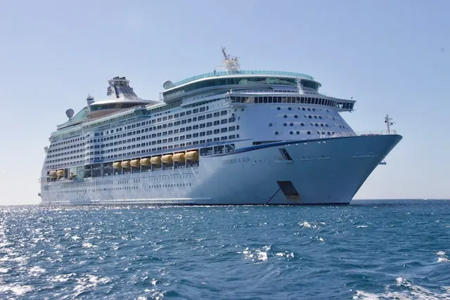 An Oasis-class cruise ship operated by Royal Caribbean International docked at the Galveston Cruise Port, symbolizing luxury transfers from Hobby Airport to the cruise terminal.