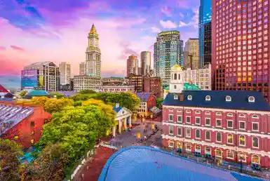 Boston, Massachusetts, USA historic skyline at dusk. - New York to Boston Car Service!