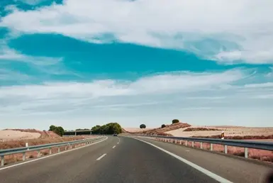 Long road and cloudy sky to symbolize private long distance transportation
