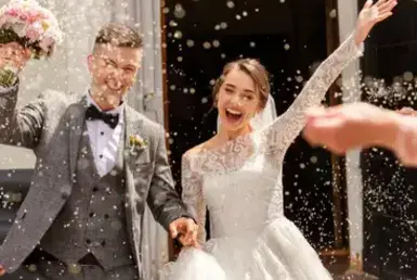 A bride and groom celebrate their wedding amidst much joy, symbolizing the luxurious transportation services for weddings in Houston.