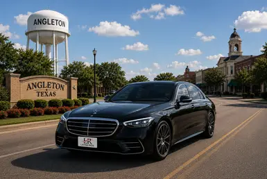 Black 2026 Mercedes-Benz S-Class sedan with Lavish Ride branded license plate driving through downtown Angleton, Texas near local landmarks and civic buildings, representing premium regional transportation and chauffeur services across Southern Houston.
