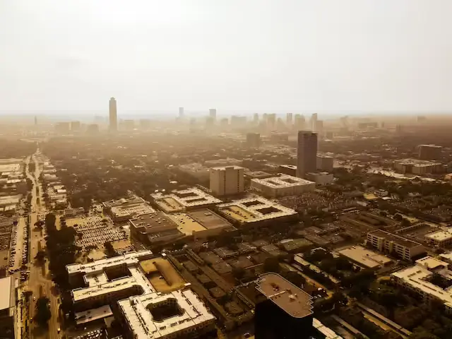 an aerial view of a city with tall buildings