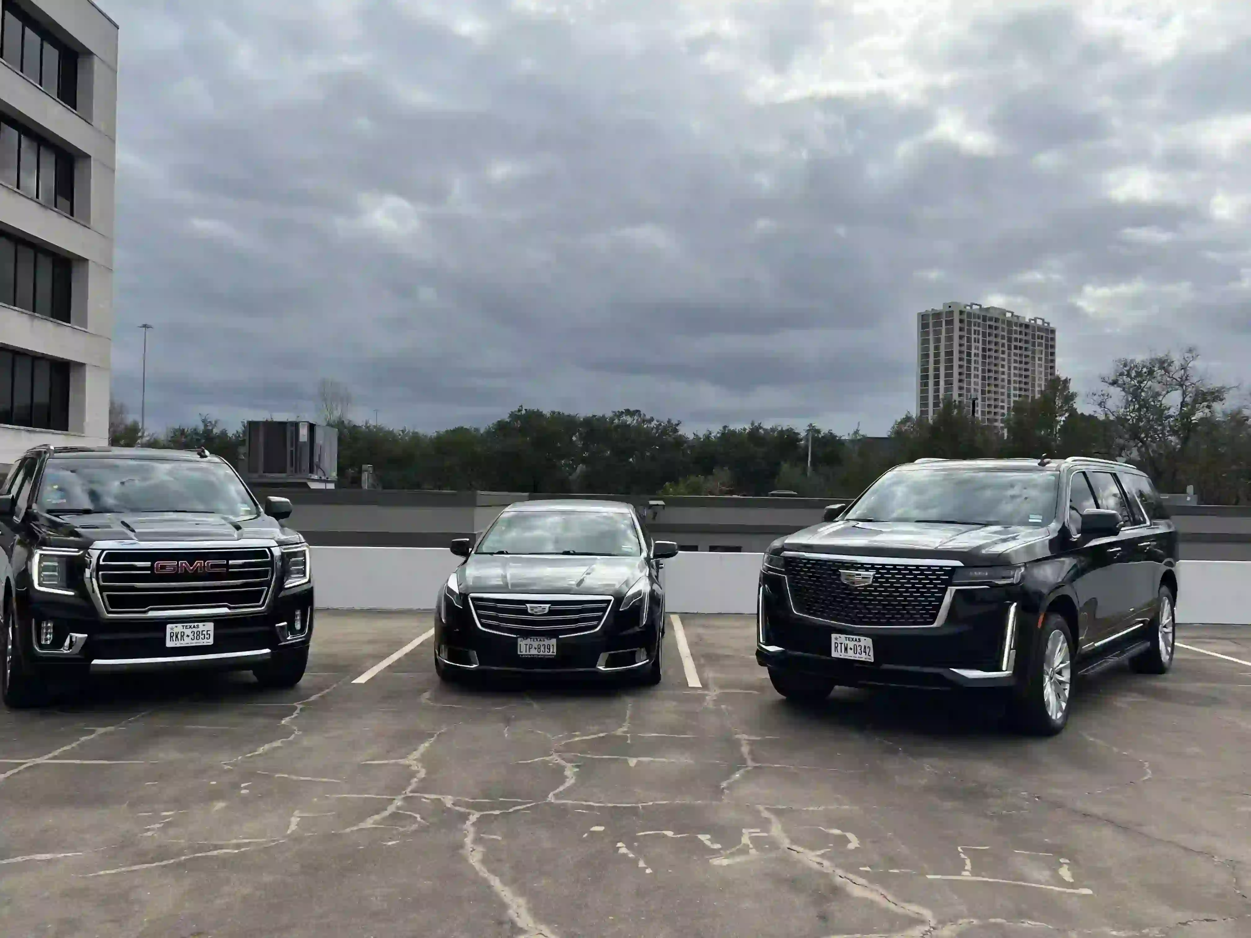 Lavish Ride's luxury fleet features a business-class sedan, a Cadillac XT6, a business-class SUV, a GMC Yukon SLT, and a first-class SUV, a Cadillac Escalade ESV—symbolizing Houston executive airport car service.