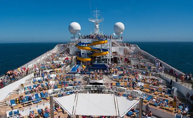 A crowded cruise ship deck with many entertainment options.